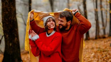 
		Couple in the fall forest in the rain
	